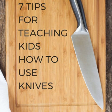 A knife on a wooden board.
