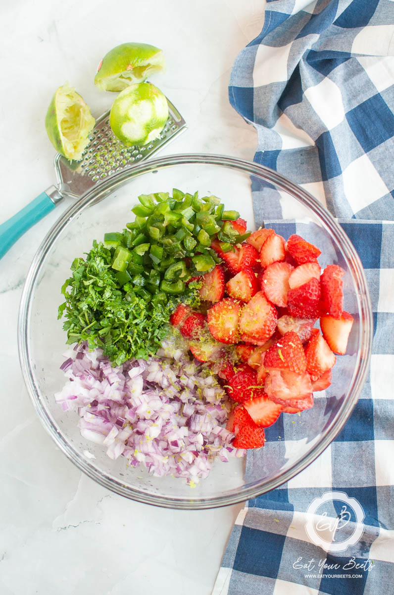 diced strawberries in a white bowl.