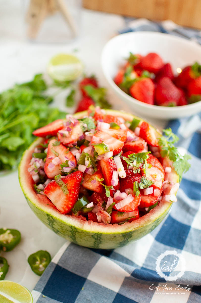 strawberry jalapeno salsa in a melon bowl.