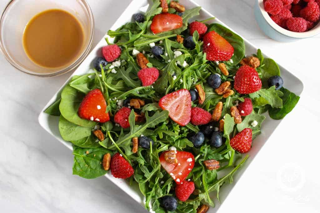 Berry salad with goat cheese in a bowl.