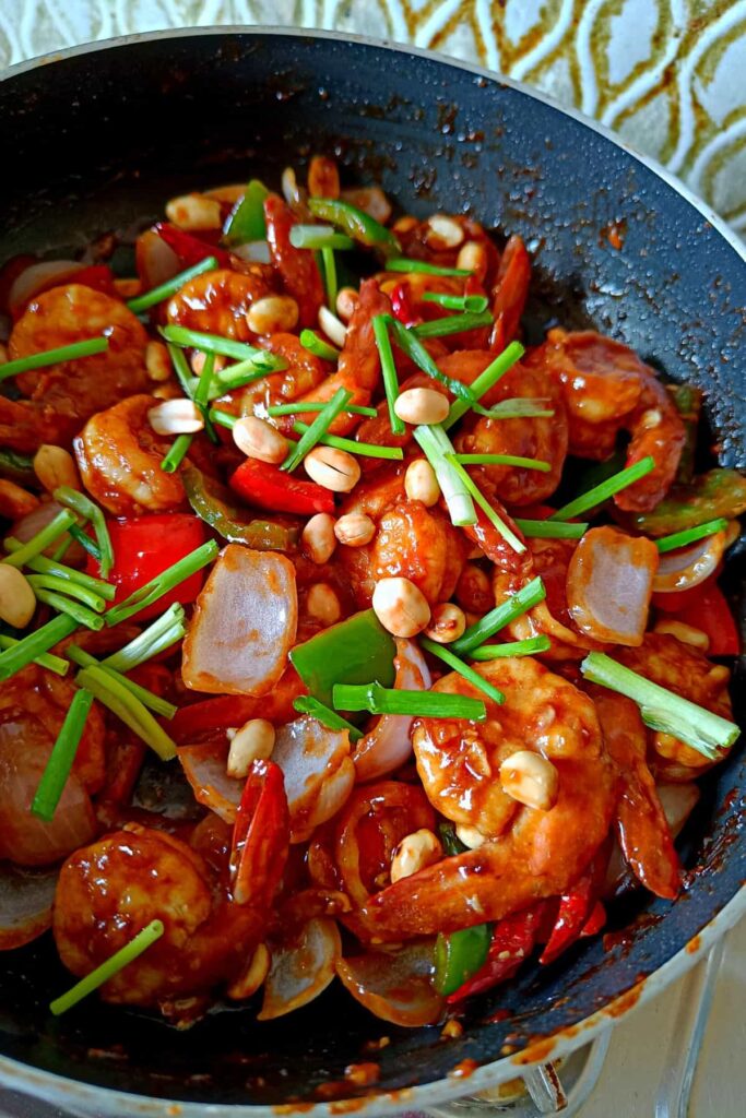 kung pao shrimps in a skillet.