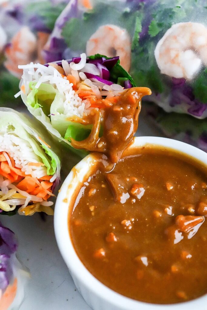 Peanut sauce served with shrimp rice paper rolls.