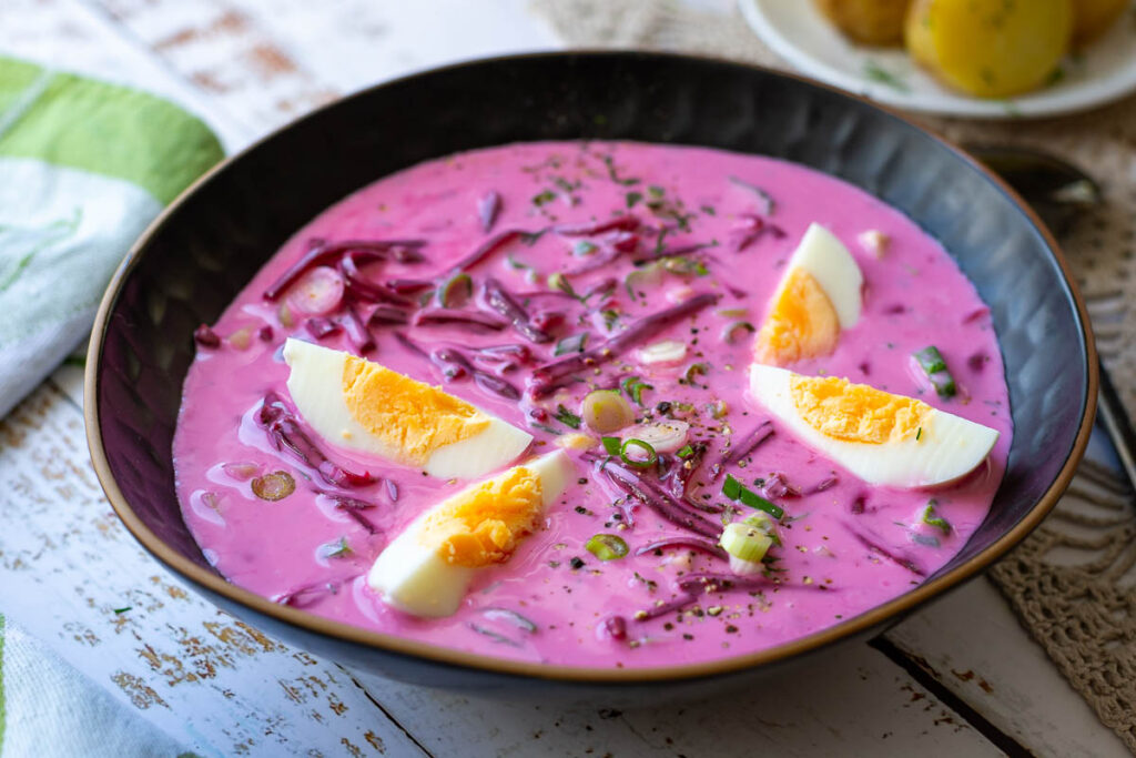 Pink beetroot soup in a bowl.
