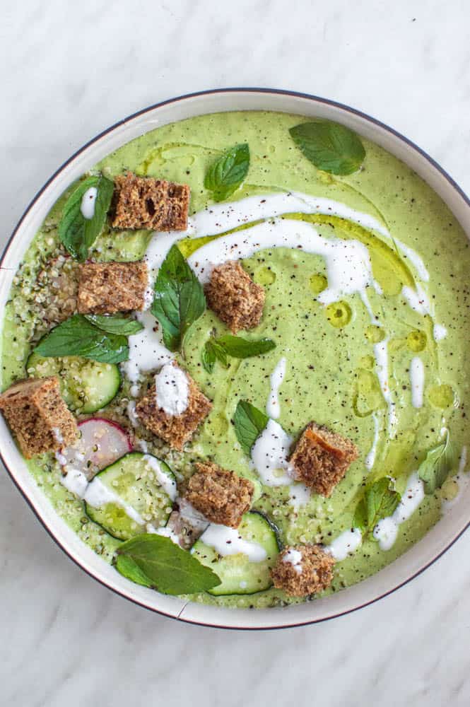 Cucumber avocado gazpacho in a bowl.