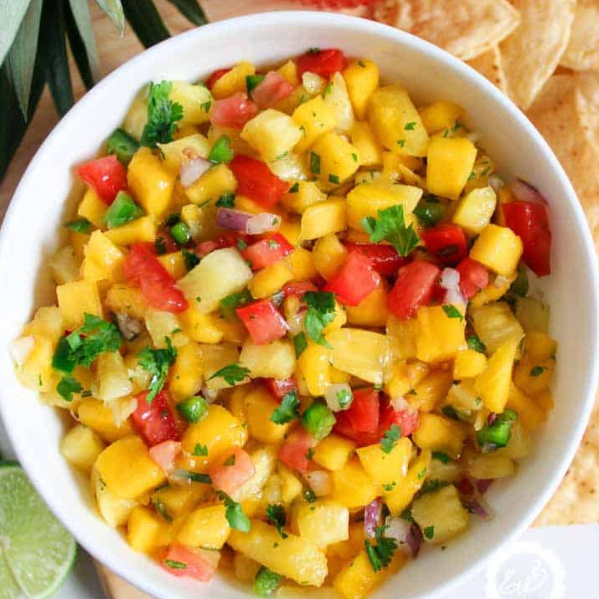 Mango and Pineapple Salsa in a white bowl.