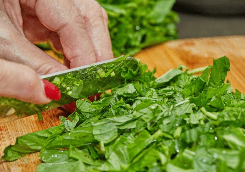 chopping basil leaves.