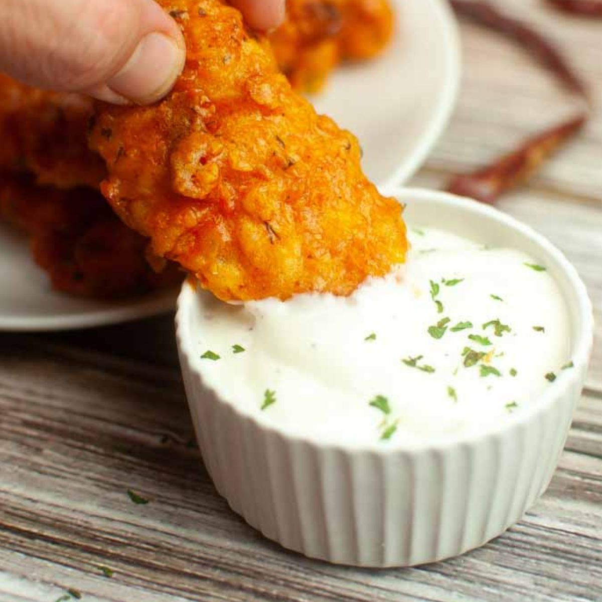 Air Fryer Chicken Tenders With Buffalo Sauce.
