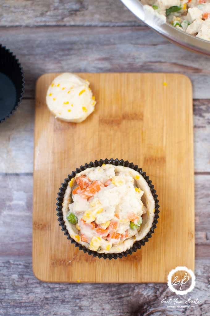 adding mixture to chicken pot pie.