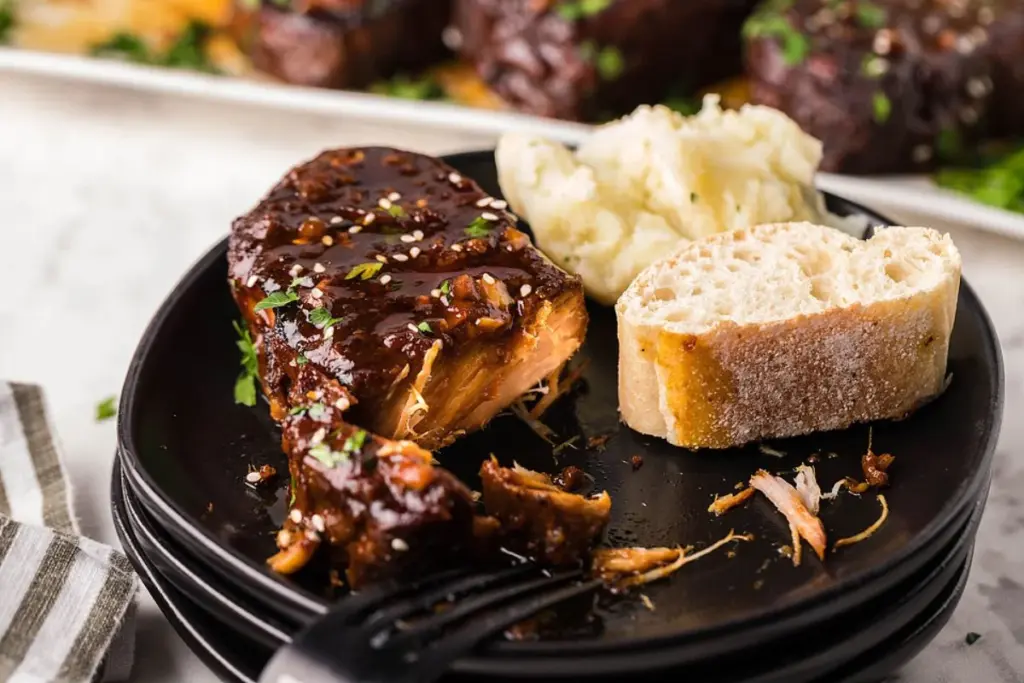 Sriracha pork chops on a plate.