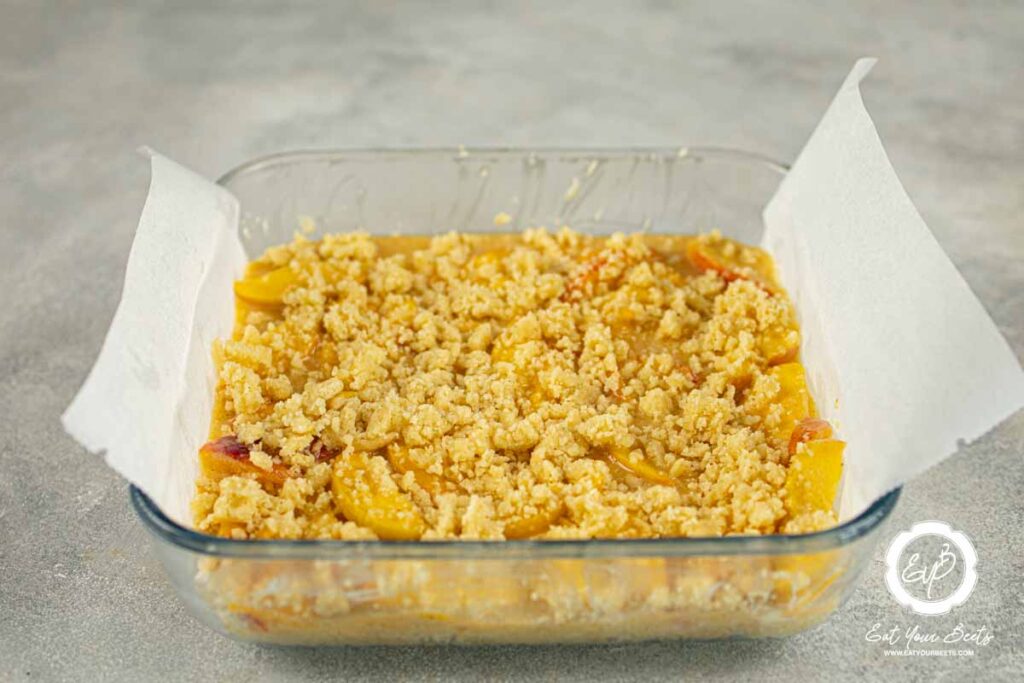 Peach pie batter in a dish.
