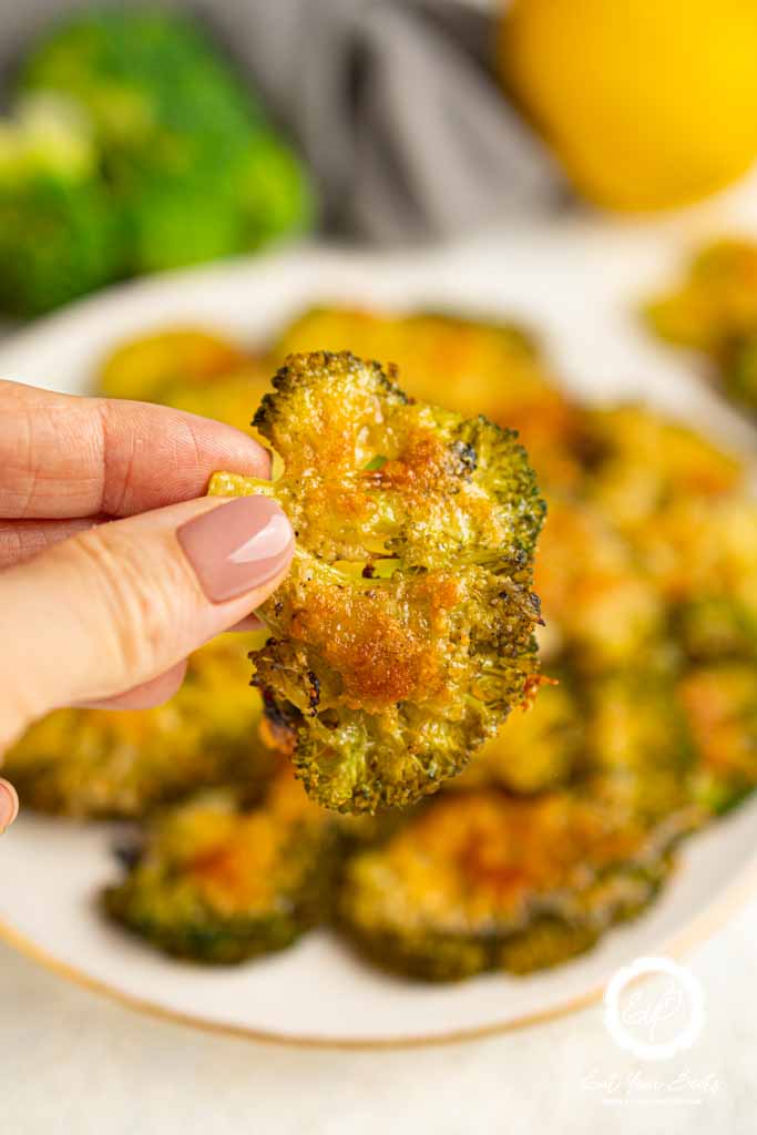 Broccoli chips in hand.