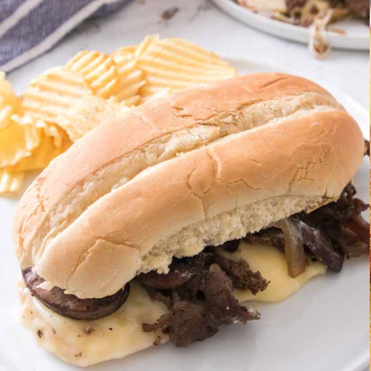 Philly Cheesesteaks With Sauteed Peppers and melted cheese.