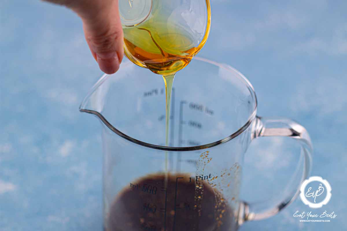 Adding maple syrup to brewed maple.