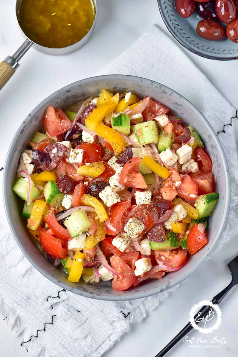 Fresh Greek salad in a serving bowl.