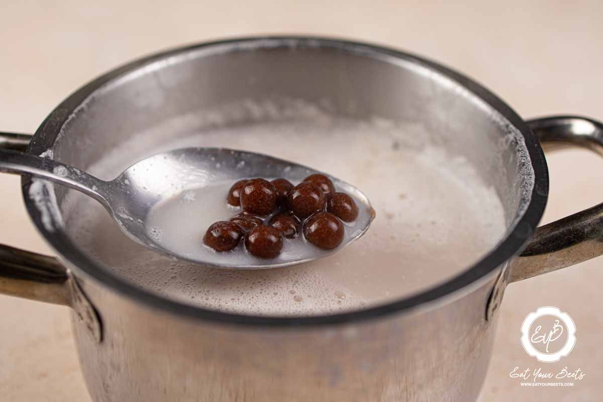 Boiling tapioca pearls with milk.