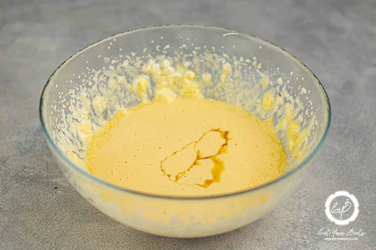 Mixture of yogurt, eggs, and maple syrup in bowl.