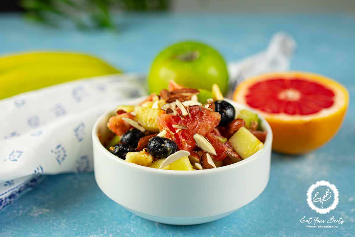 Fresh fruits salad made blueberries, grapefruit, apple, and banana.