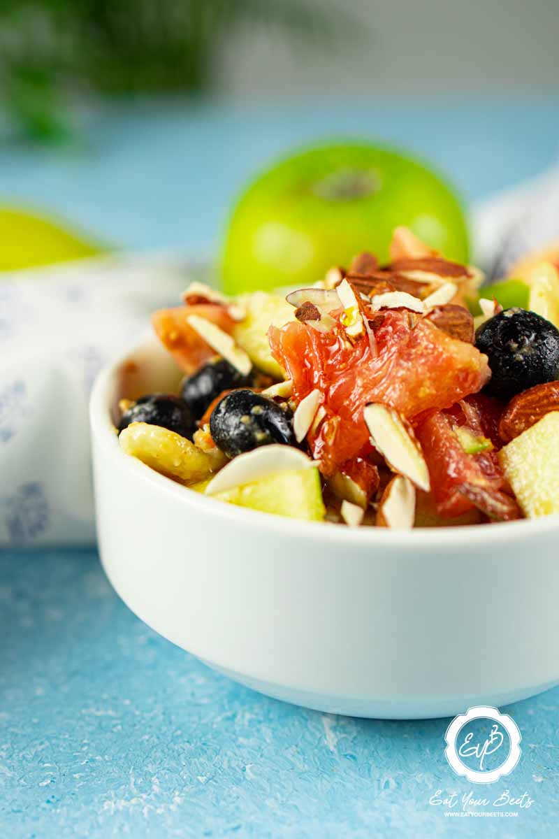 Apple grapefruit salad in a bowl.