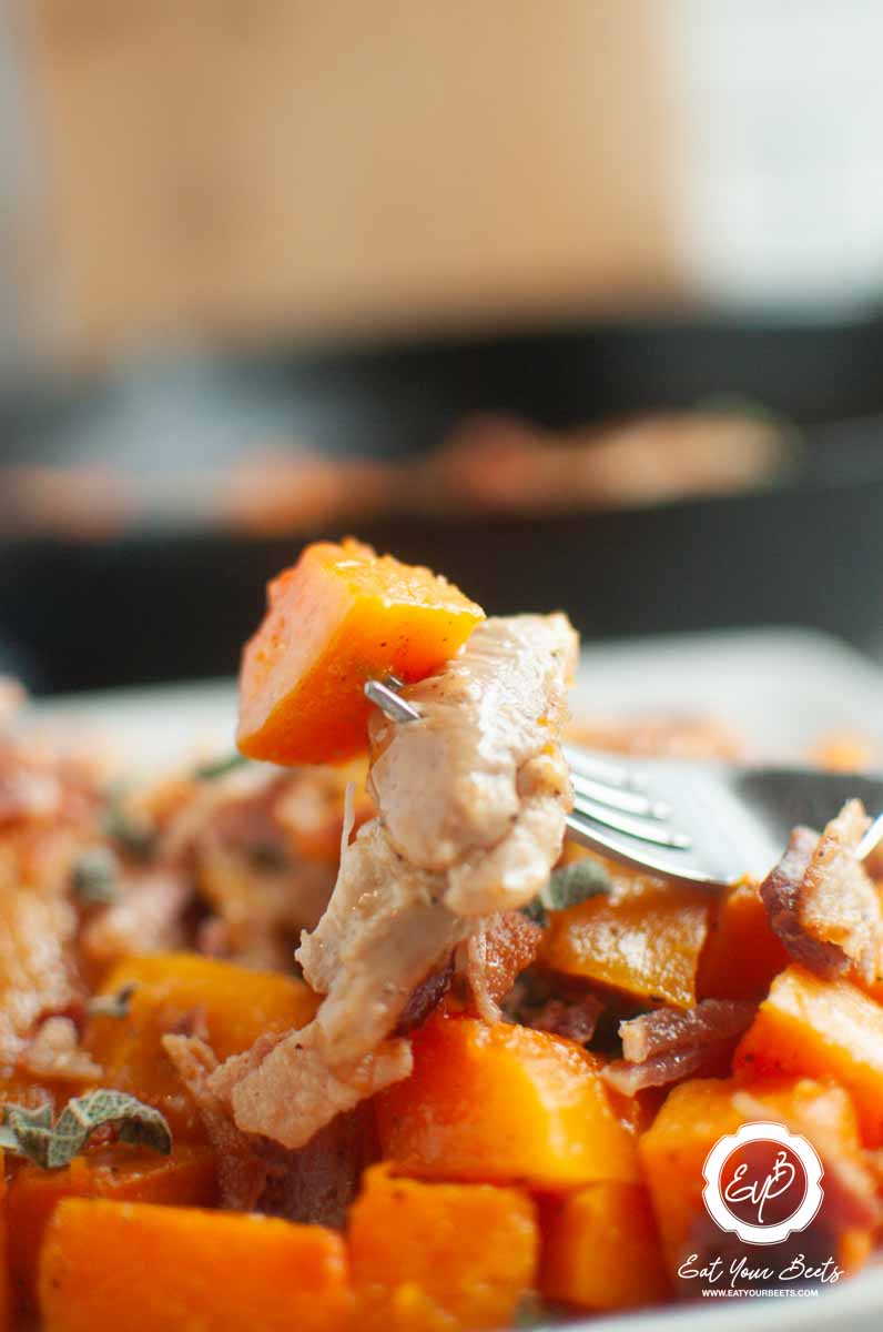 Serving chicken and butternut squash with a fork.