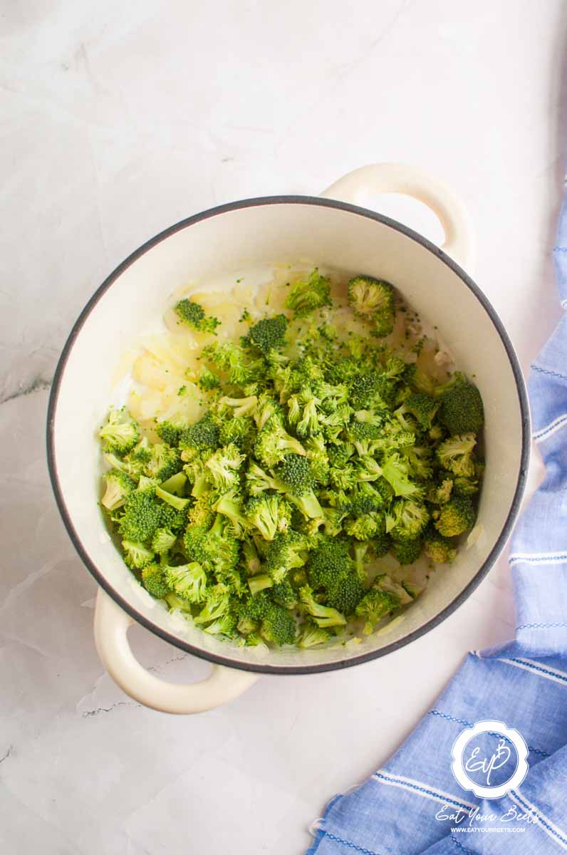 Broccoli and onion in a pan in a pot.