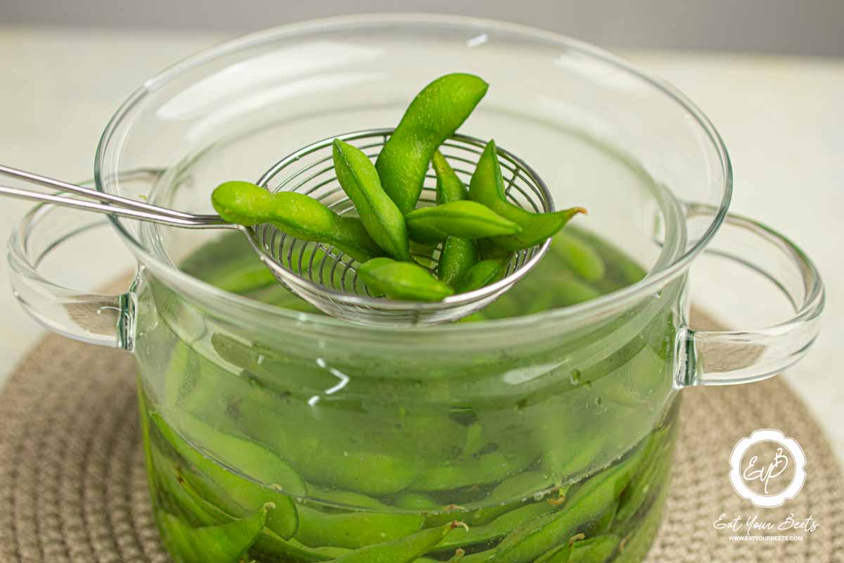 Boiling edamame in a pot. 