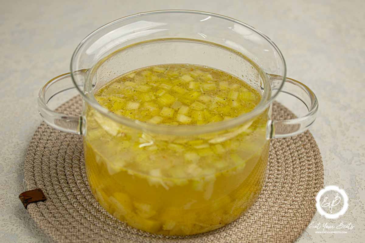 Vegetable mixture with broth in a pot. 