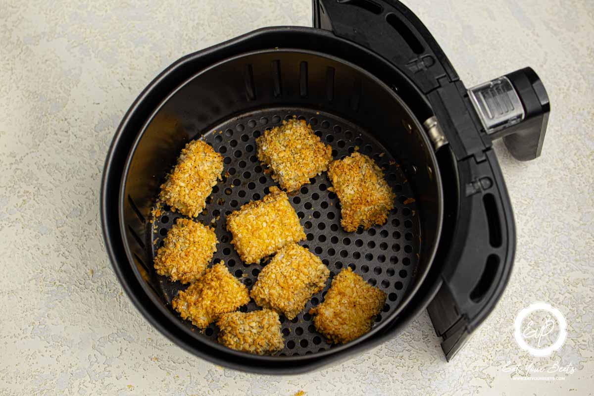 air fried fish nuggets in air fryer basket.
