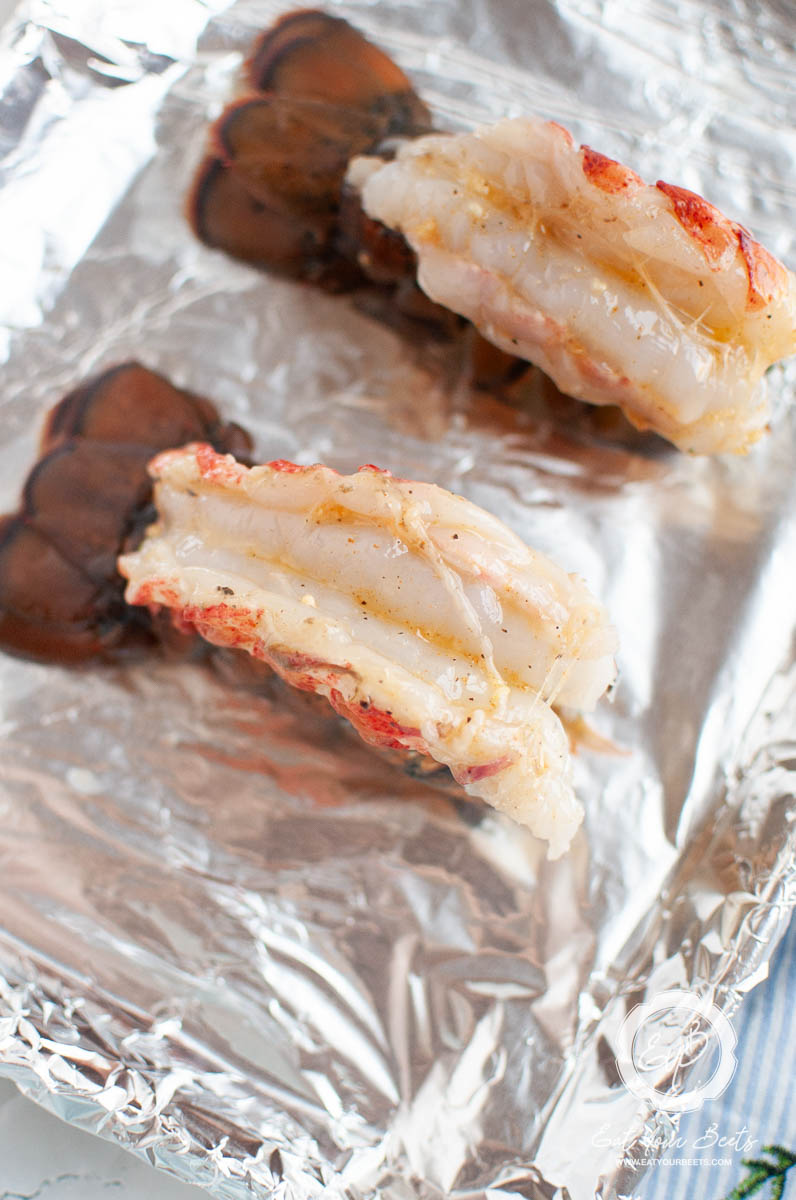Lobster tails on the tin foil.