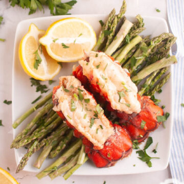 Oven baked lobster tail with garlic butter and lemon.