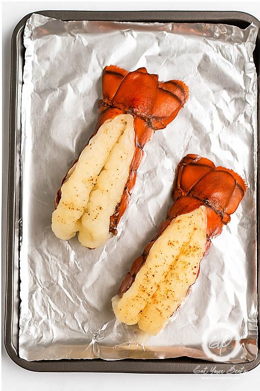 lobster on tin foil on baking sheet.