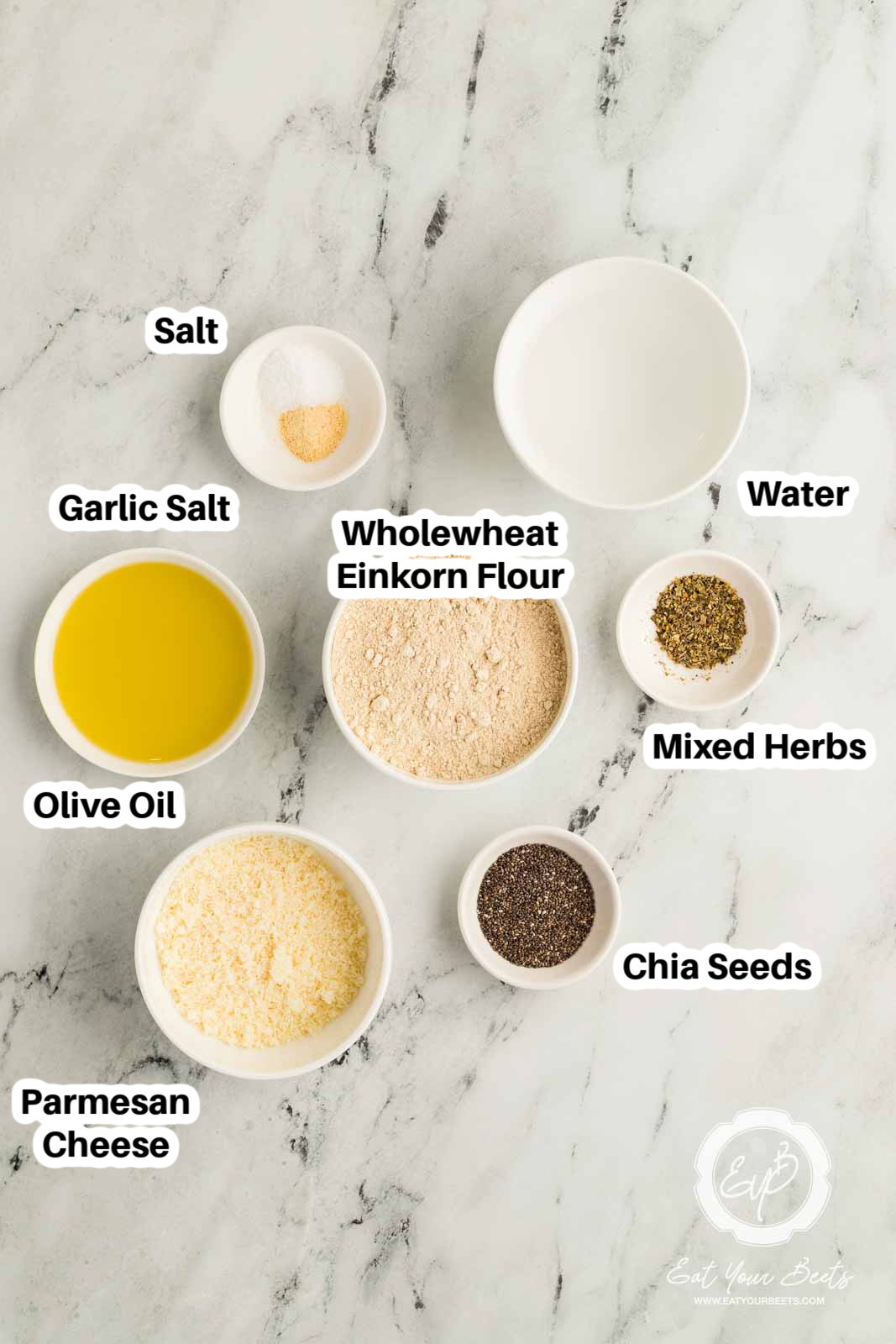 Einkorn Crackers Ingredients. Water, Chia Seeds, Einkorn Flour, Olive Oil, Salt, Garlic Salt, Parmesan Cheese, mixed herbs.