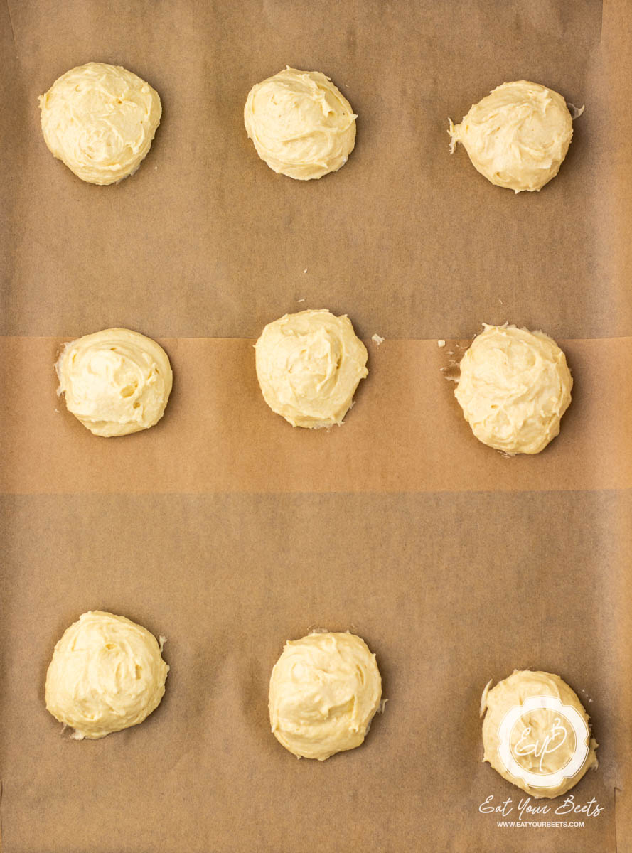 Cookie batter scooped onto a baking sheet.