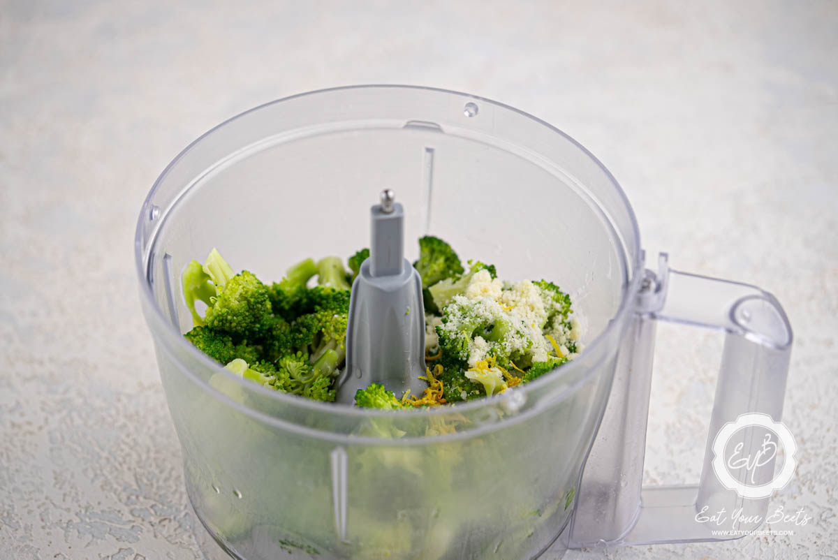 Ingredients for pureed broccoli in a food processor.